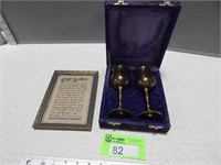 Brass goblet set in a case and a framed verse
