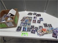 Box of assorted trading cards; mostly baseball and