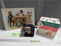 Singer toy sewing machine with a box; metal sign