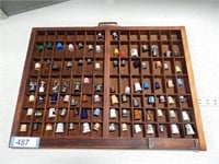 86 Thimbles, old and new, in a printer's tray