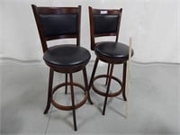 Swivel bar stools with padded seats and backs; sea