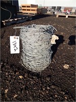Partial roll of barbed wire