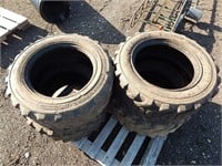 4 Skid loader tires on rims; 10-16.5