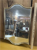 Decorative beveled mirror with brass surround