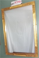wall mirror in gilded frame