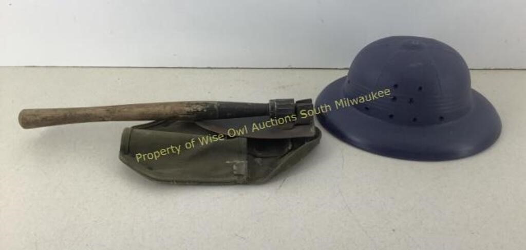 Plastic safari helmet and military trench shovel