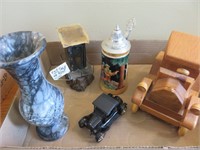 Stein, marble vase, wooden car