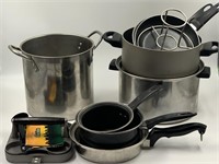Box lot of pots and pans and lids, including