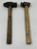 2 hammers with wooden handles