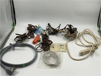box of assorted ext cords with 1 three wire