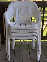 4 white plastic chairs