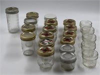 Assortment of jelly/jam canning jars, some with