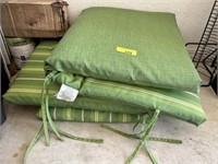 2 green lounge cushions