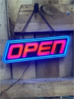 Electric hanging open sign. Working at time of