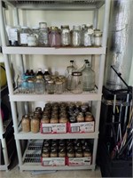 4 Shelves Of Bottles and Canning Jars