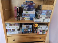 LOT OF JIGSAW PUZZLES &book Case