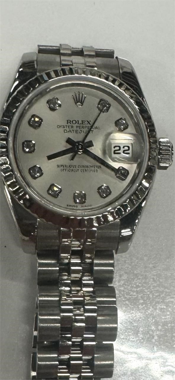 Ladies, diamond Rolex with boxing papers