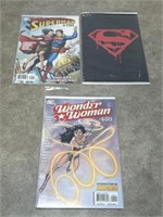Superman and Wonder Woman comic books