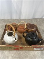 Assortment of teapots and cups