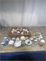 Large assortment of porcelain tea cups, bowls,