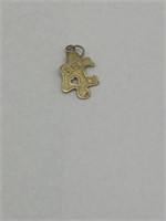 Puzzle charm- marked 14k yellow gold-.6 grams