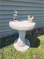 Concrete lawn pedestal with squirl & bird.