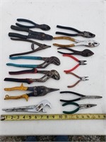 Assortment of tools including tin snips,pliers