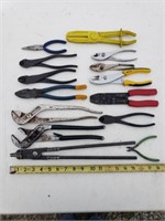Assortment of tools including wire strippers,