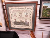 Framed contemporary sampler featuring dog chasing
