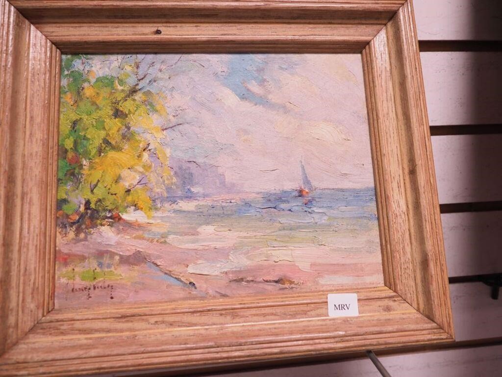 Small signed seascape featuring a sailboat,