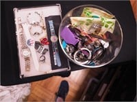 Container of wristwatches including Barbie,