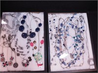 Two containers of mostly necklaces including