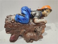 Ceramic Boy on Log