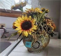 Beautiful fake flowers in a planter pot
