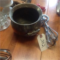 brass pot and hand mixer