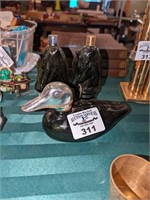 Duck and horse head cologne bottles