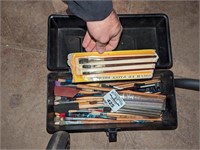Tool box of assorted paint brushes