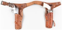 2 DIE-CAST REVOLVER CAP GUNS AND LEATHER HOLSTER