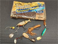 Assorted fishing lures and power bait.