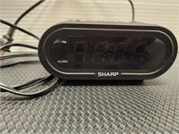 Sharp electric clock. Tested works