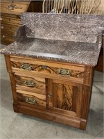 Antique washstand with marble top and backsplash