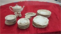 SET OF CHINA THAT NEEDS A GOOD CLEANING