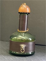 Green glass decanter bottle w/leather belts &