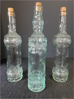 3 tall glass bottles with corks, approx 12 1/2in