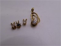 (4) small Gold? or Gold Toned" Pendants