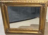 Ornate beveled wall mirror