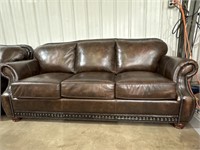 Brown leather couch with nailhead design