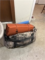 LARGE CAMO BAG WITH BED ROLLS AND BLANKET