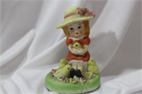 A Ceramic Girl Figurine