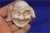 A Small Ceramic Face